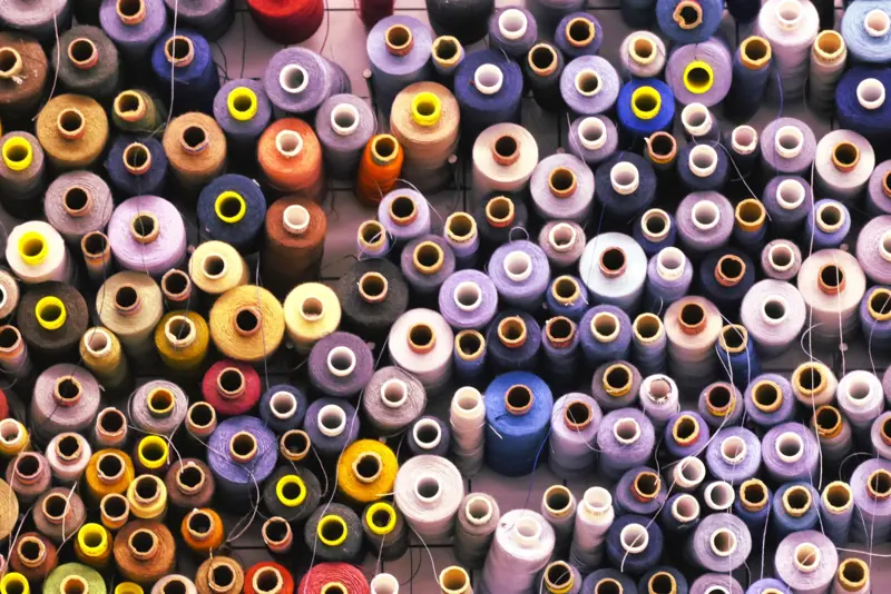 Wall of colorful thread spools