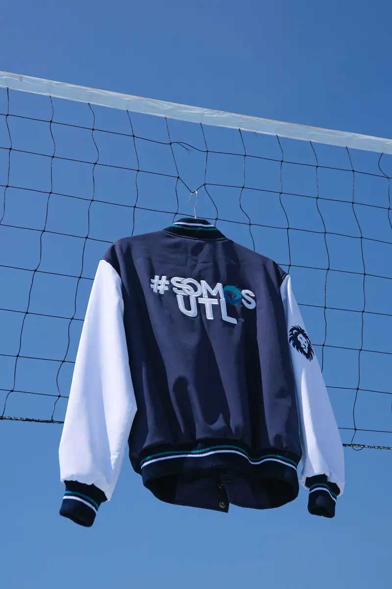 Varsity jacket with embroidered and applique lettering